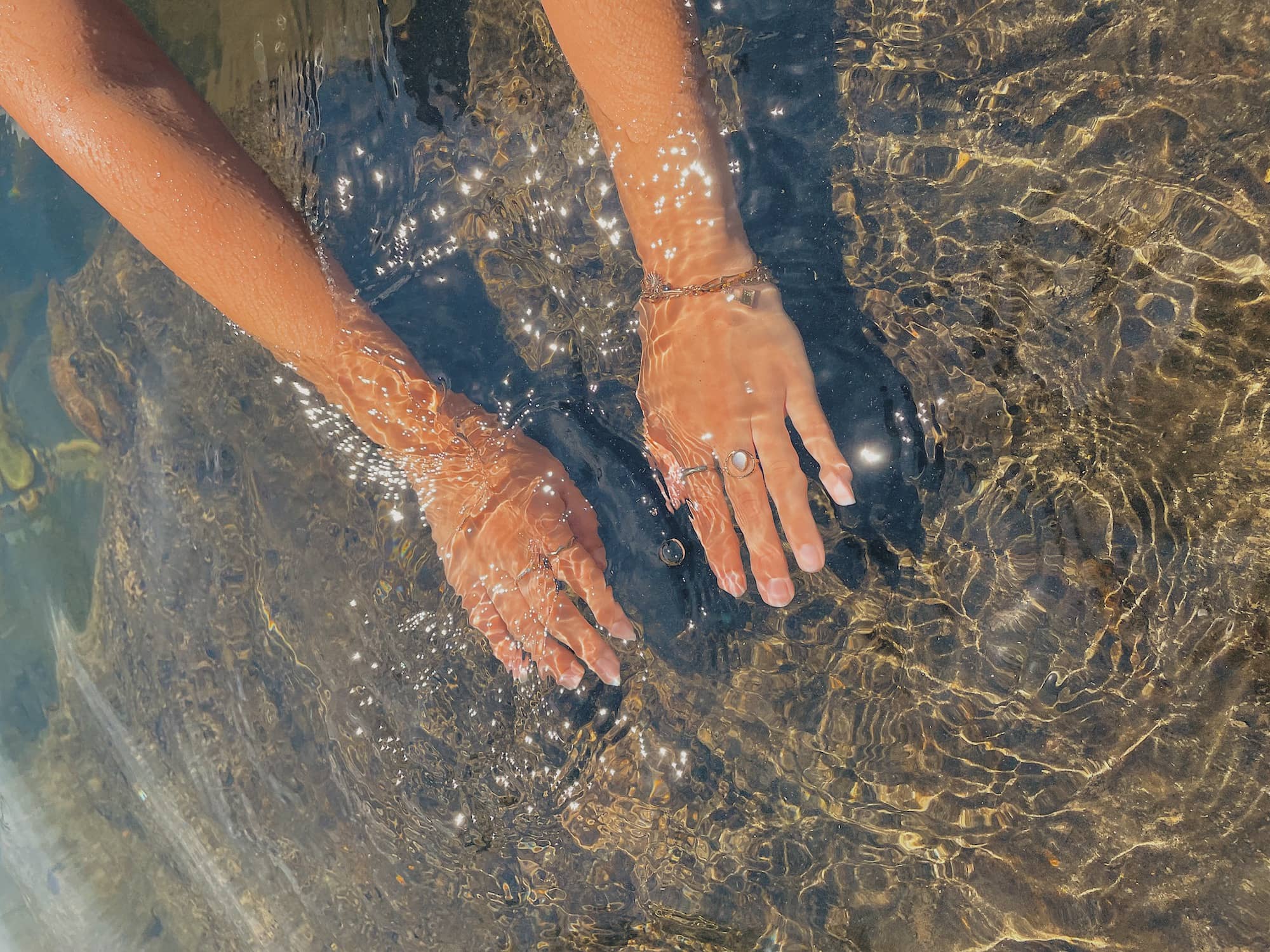 hands in clean water
